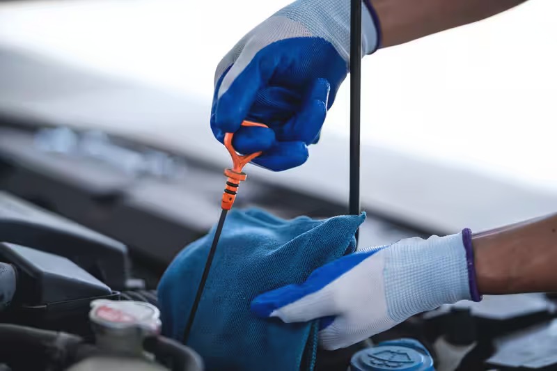 What are the most common warning signs of low transmission fluid?